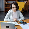 Worried Woman Calculating Bill
