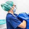 Nurse Putting on Protective Gear